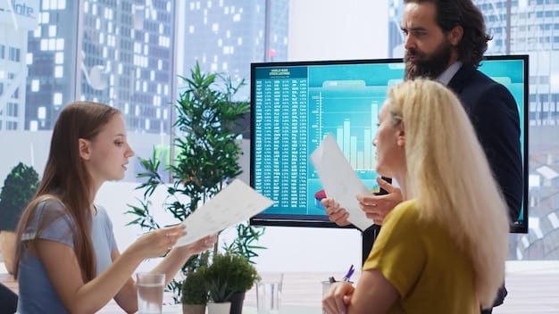 A sales team using AI-powered dashboards in a modern office, illustrating real-time sales metrics and customer insights.